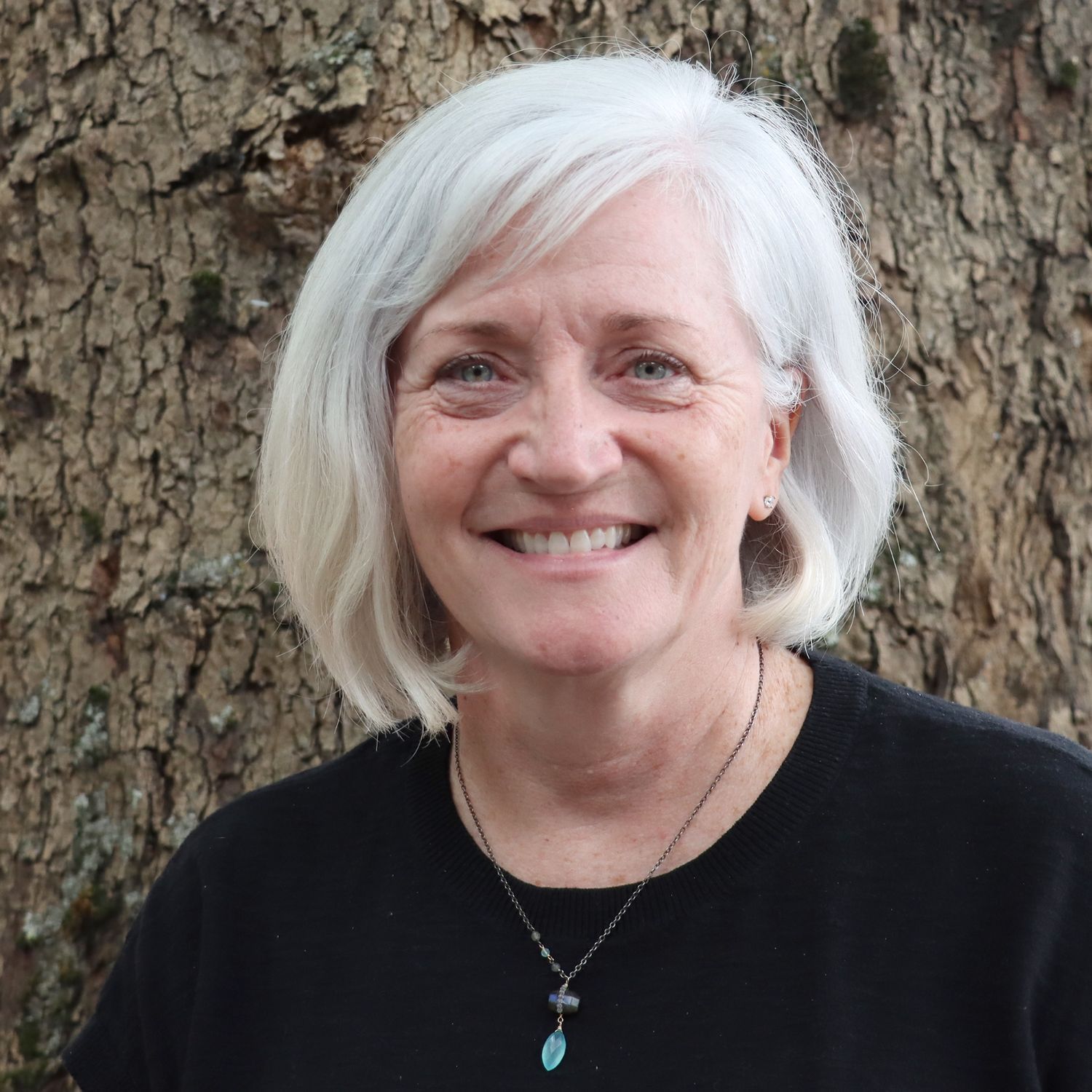 DRO advocate and PIP coordinator Coleen Carey. She is wearing a black shirt and has shoulder-length silver hair